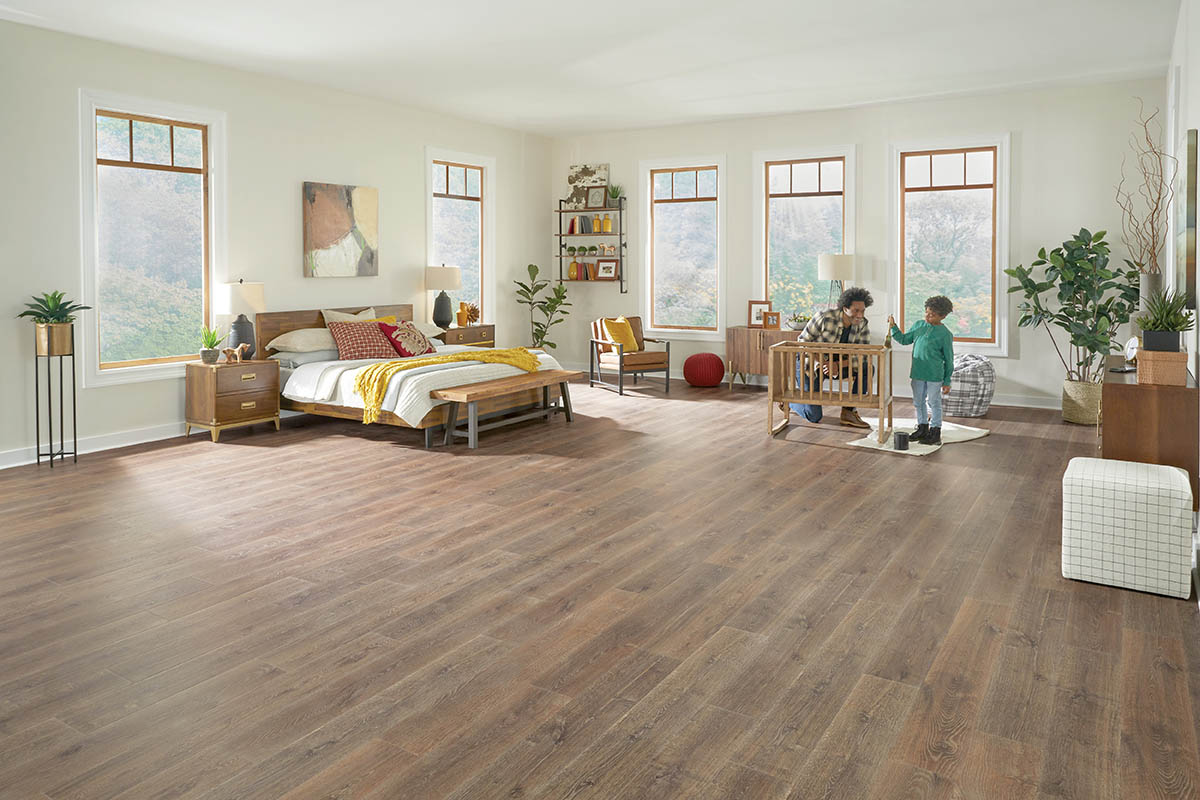 Children playing on vinyl plank flooring in a bright bedroom